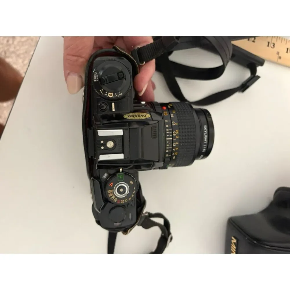 Minolta X-700 with accessories and carry case.